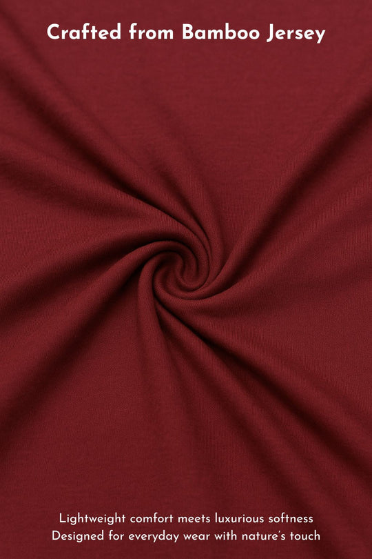 Close-up of red fabric with text about bamboo jersey and comfort.